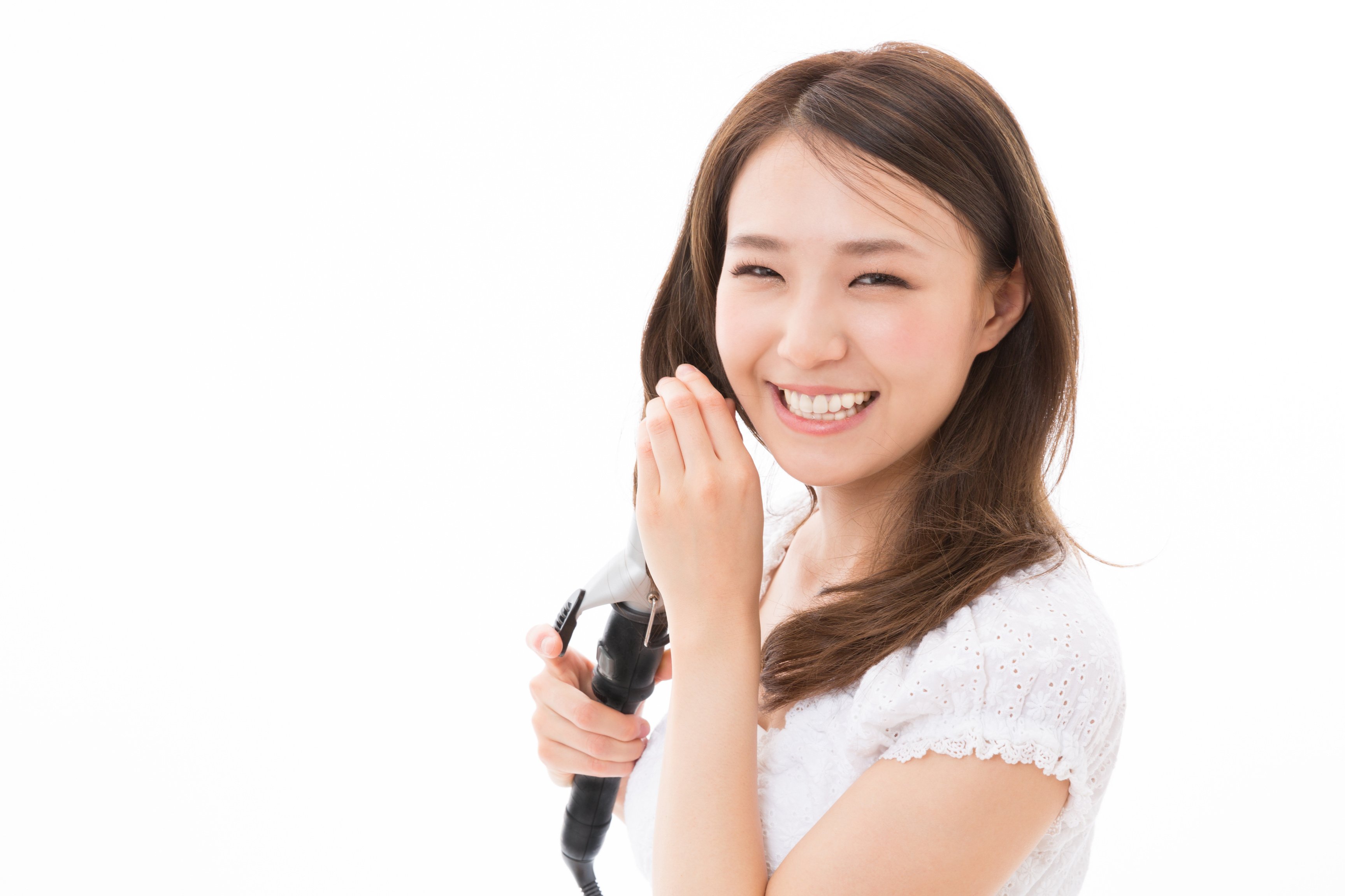 Japanese woman using hair ironing