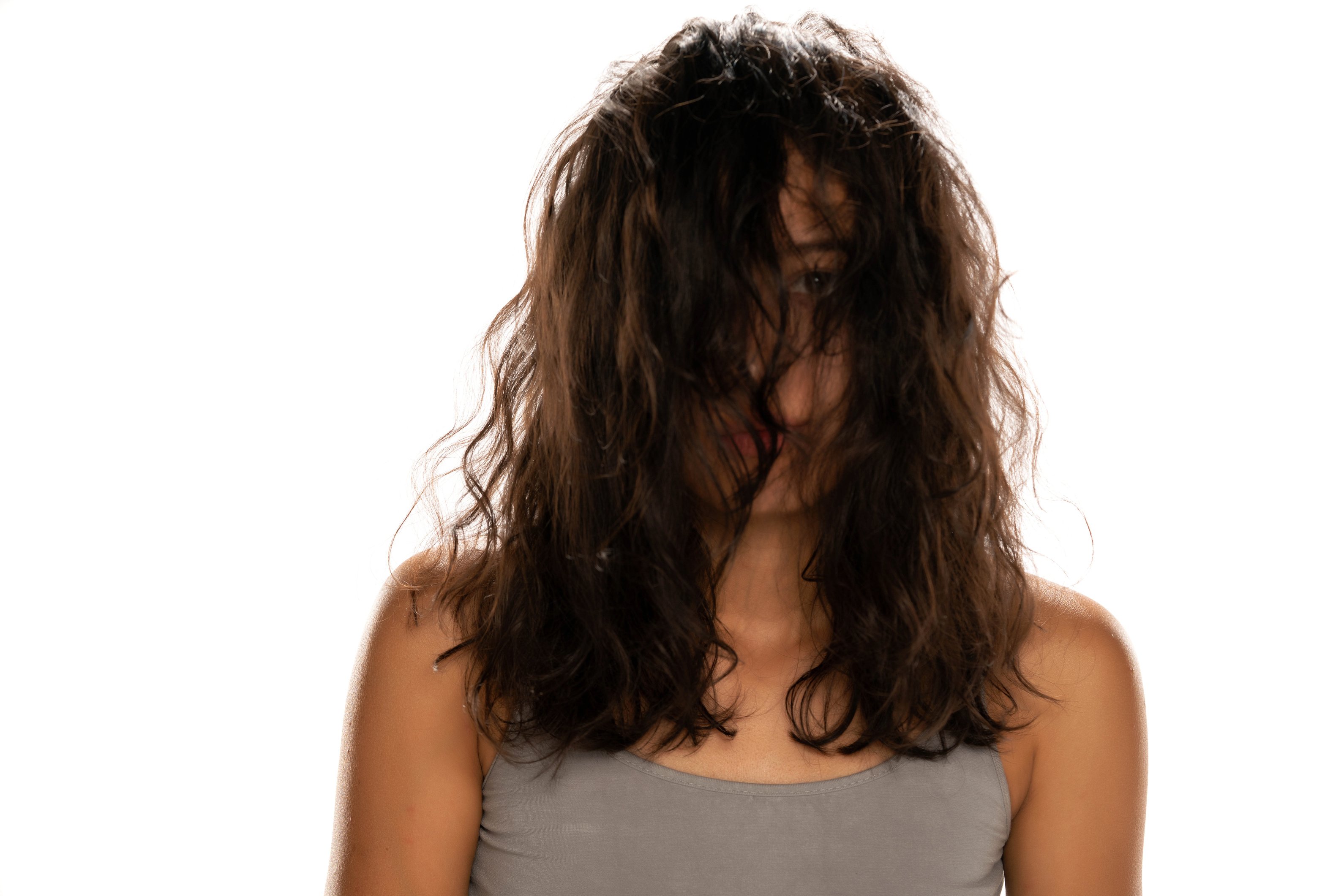 Young unknown woman with messy hair